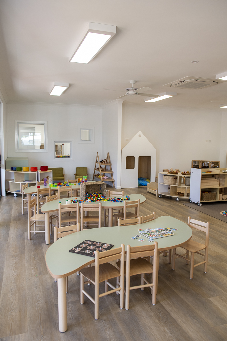 A learning environment at First5Years Emerald, with timber shelving and natural light.