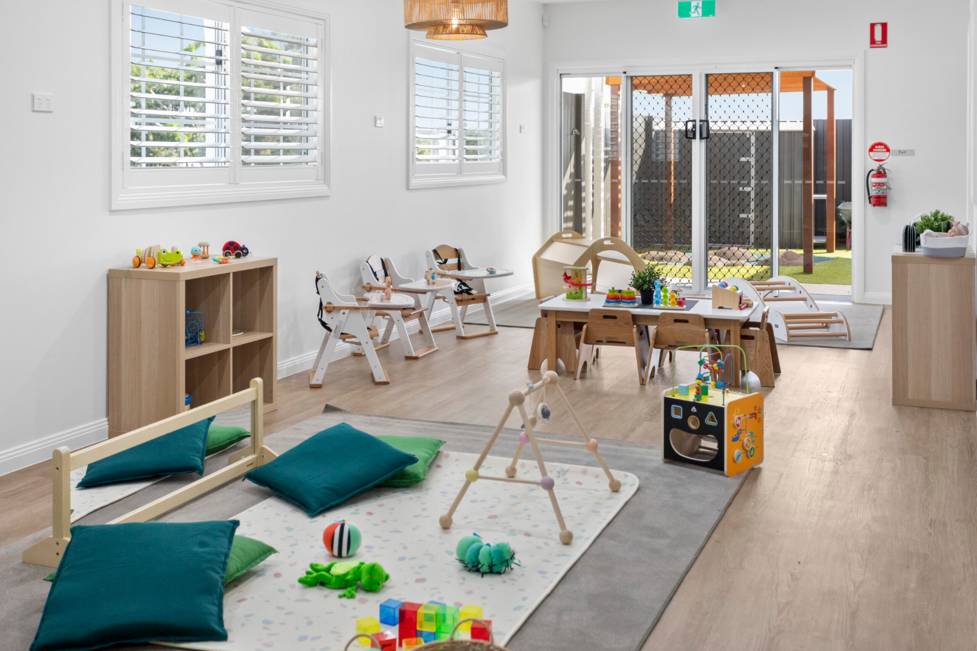 A nursery environment at First5Years Calliope with space for rest, care and floor play.